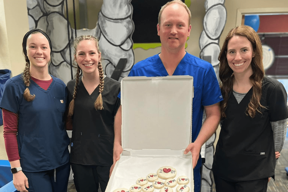 Jarvis Pediatric Therapy staff with a box of cookies