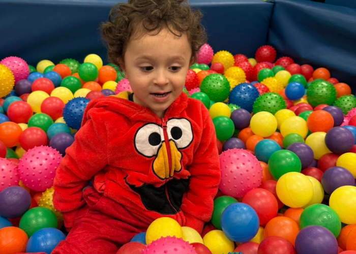 Child playing in ball pit
